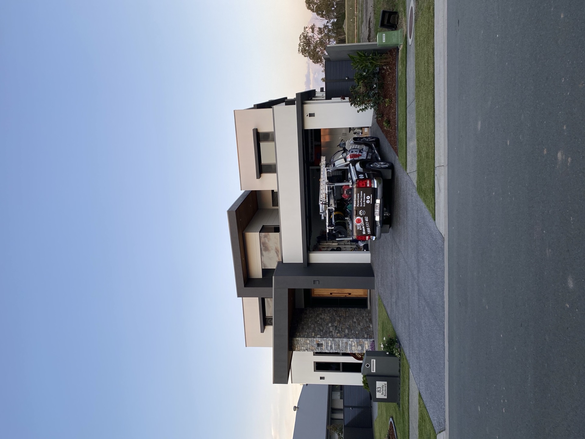 Zen Window Cleaning branded ute on the driveway of a modern Gold Coast home - Robina context