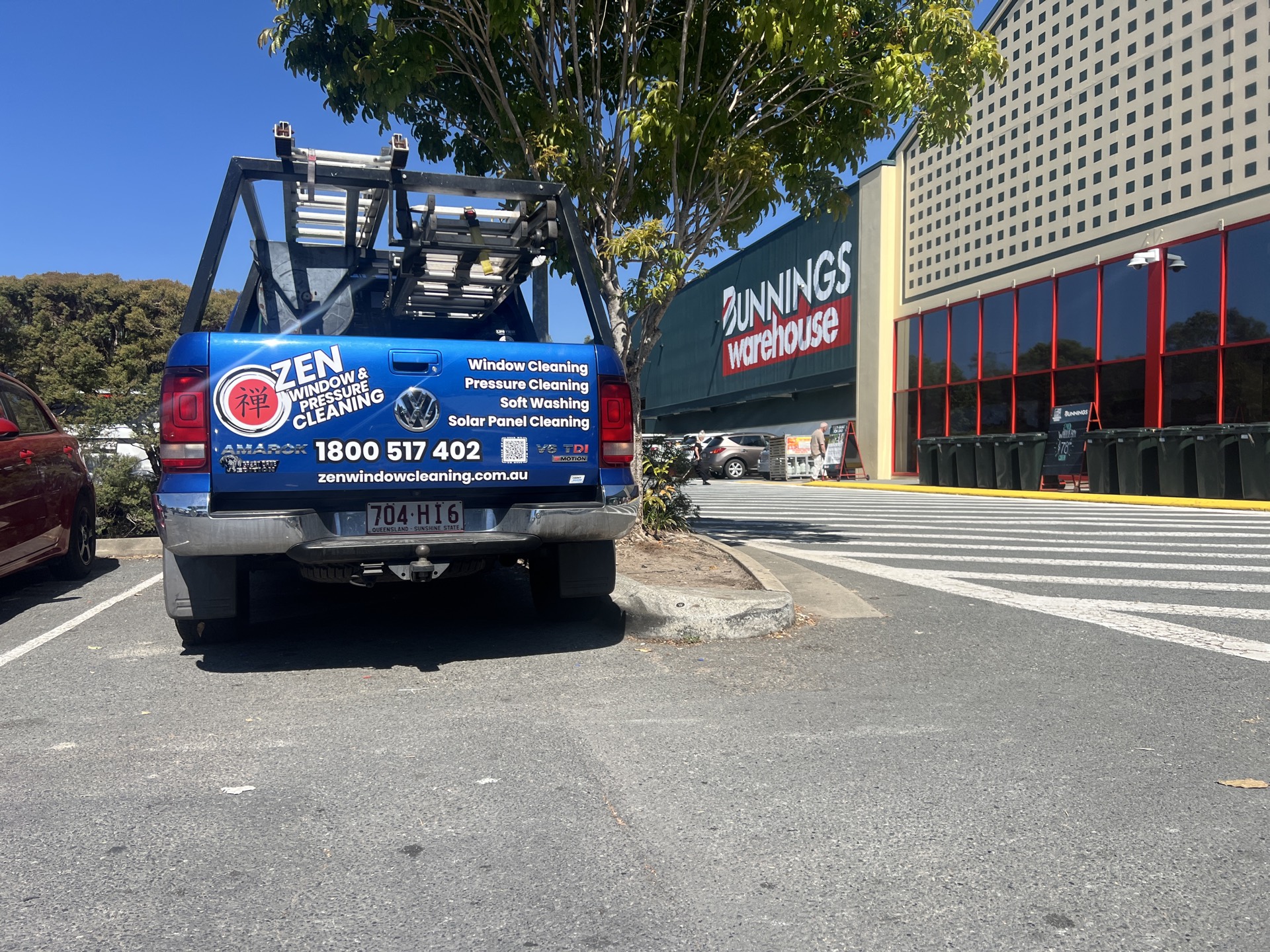 Zen Window Cleaning ute in the car park at Bunnings Nerang with the warehouse sign behind