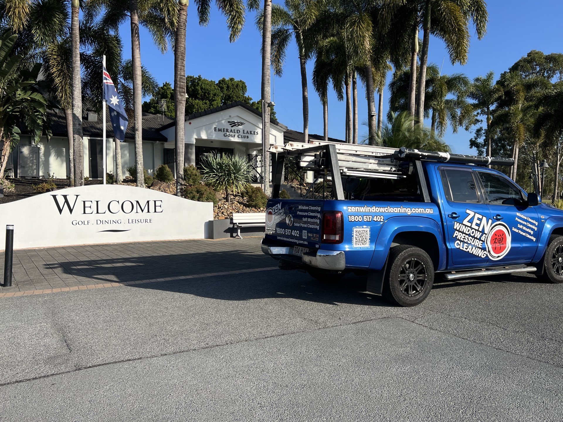 Zen Window Cleaning ute at the Emerald Lakes welcome sign in Carrara