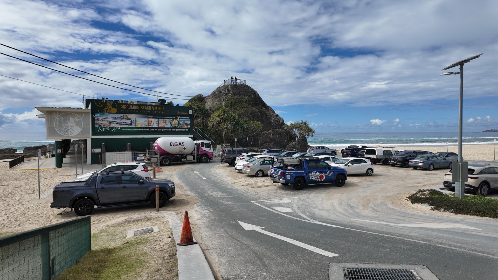 Zen Window Cleaning ute at Currumbin Beach with Elephant Rock and the surf club in view