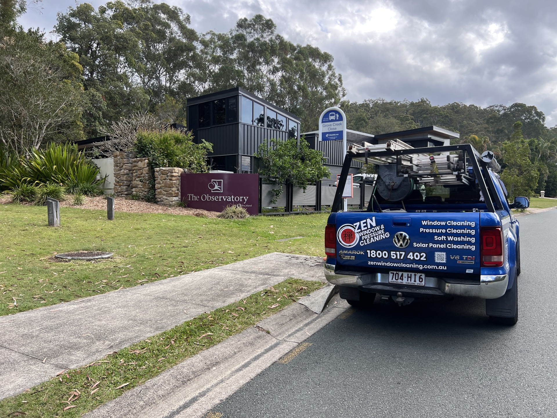 Zen Window Cleaning ute beside The Observatory estate sign in Reedy Creek