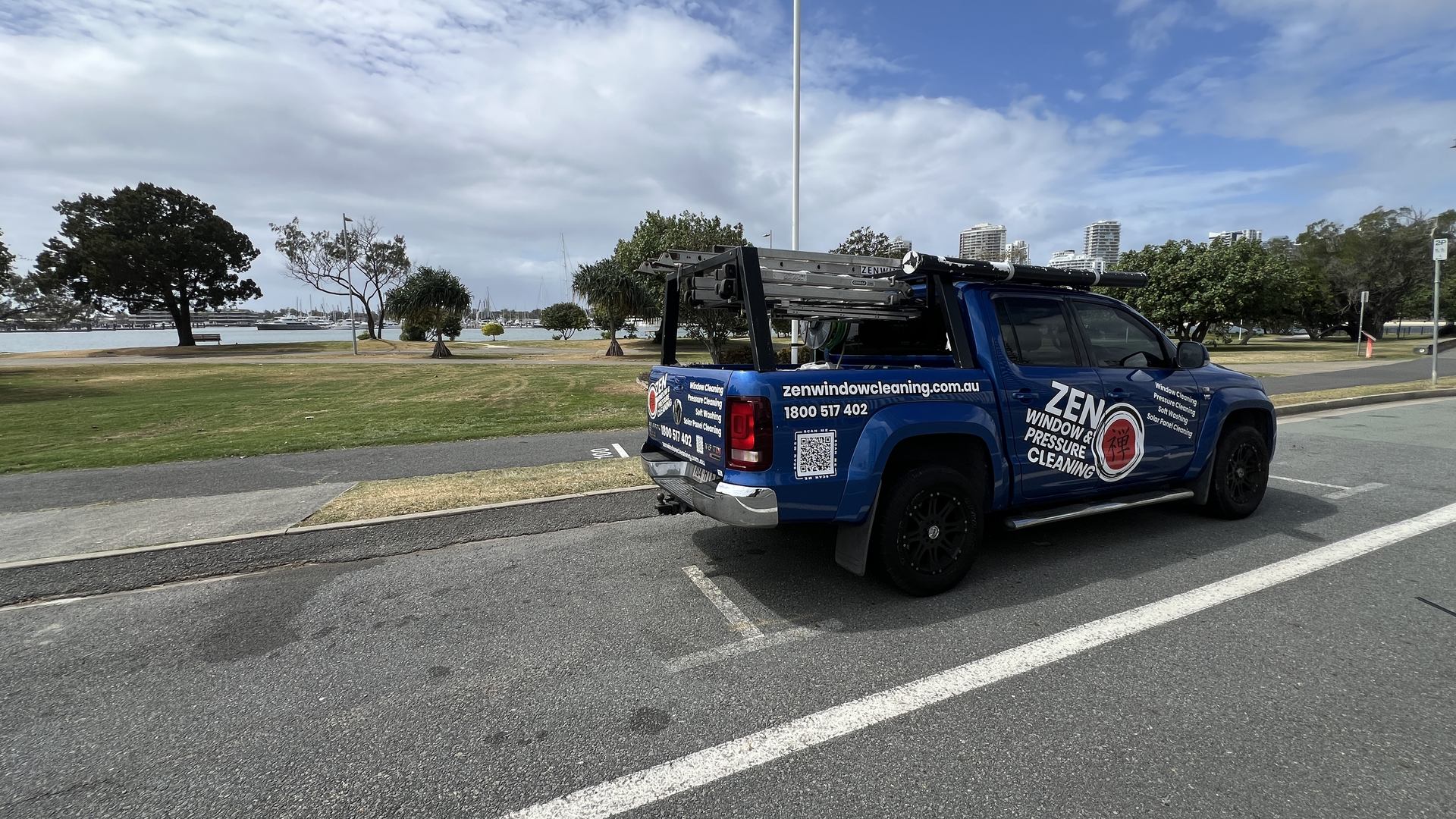 Zen Window Cleaning ute parked at Broadwater Parklands, Southport, with the Broadwater behind