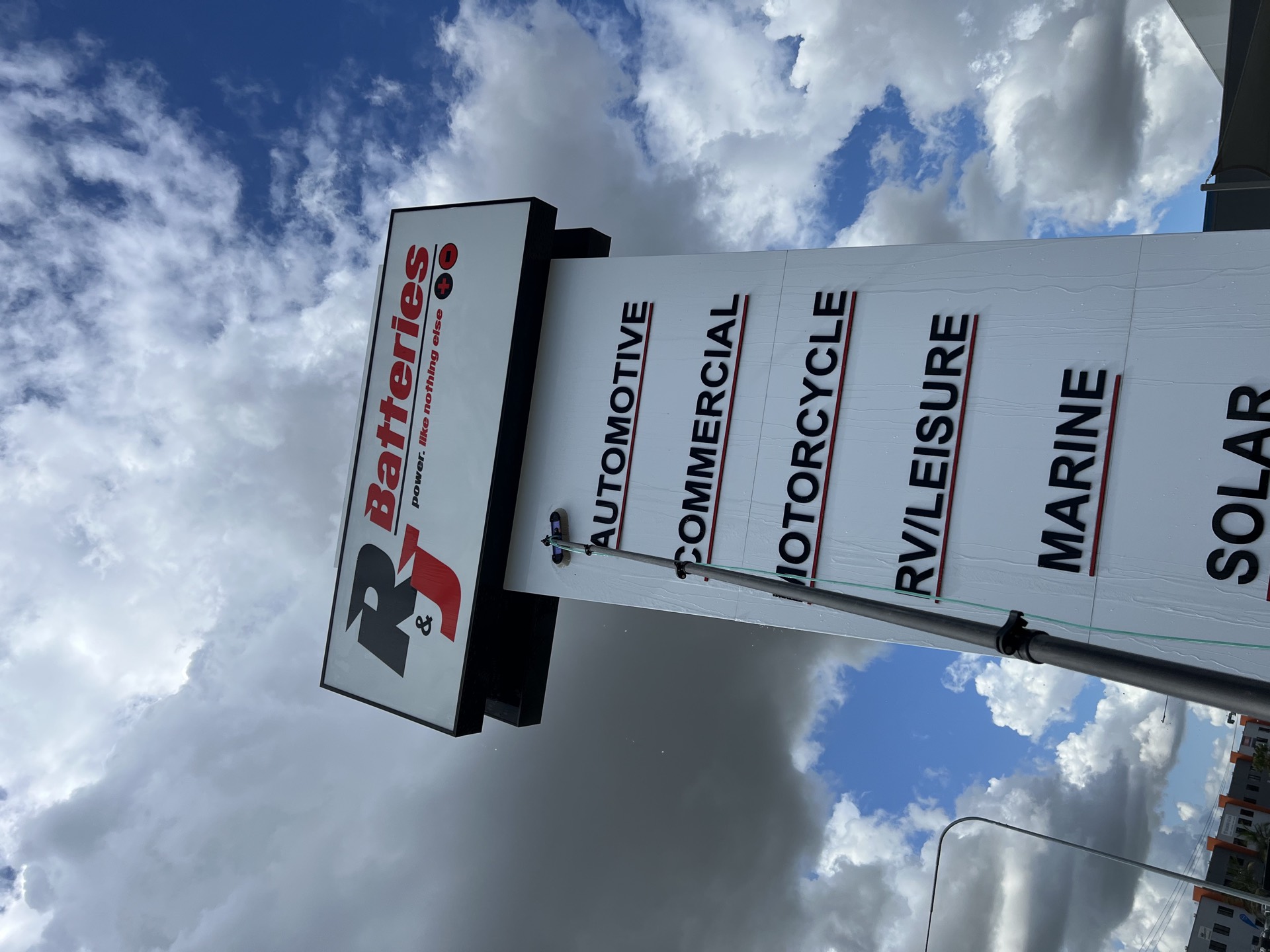 Professional signage cleaning on the Gold Coast by Zen Window Cleaning using extended reach systems.