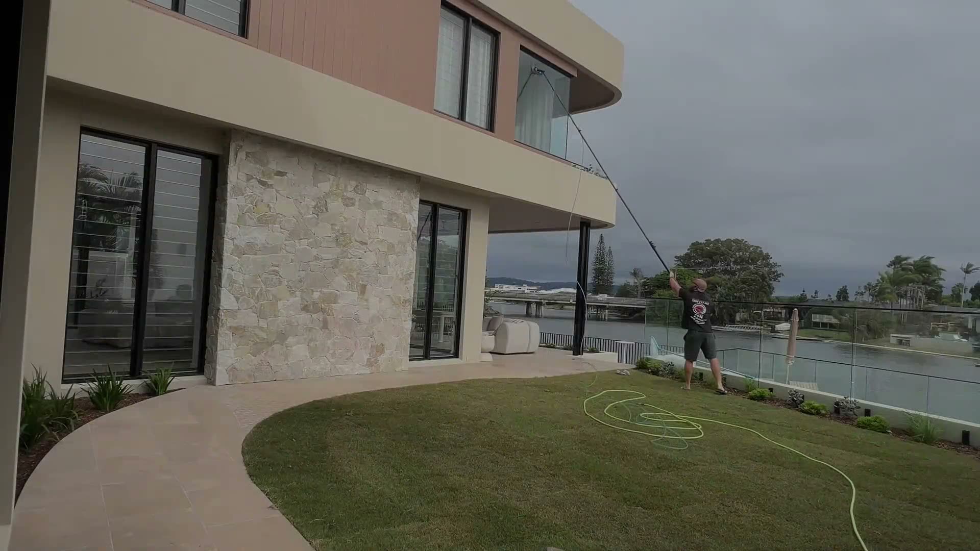 Water-fed pole window cleaning on a multi-storey Gold Coast property
