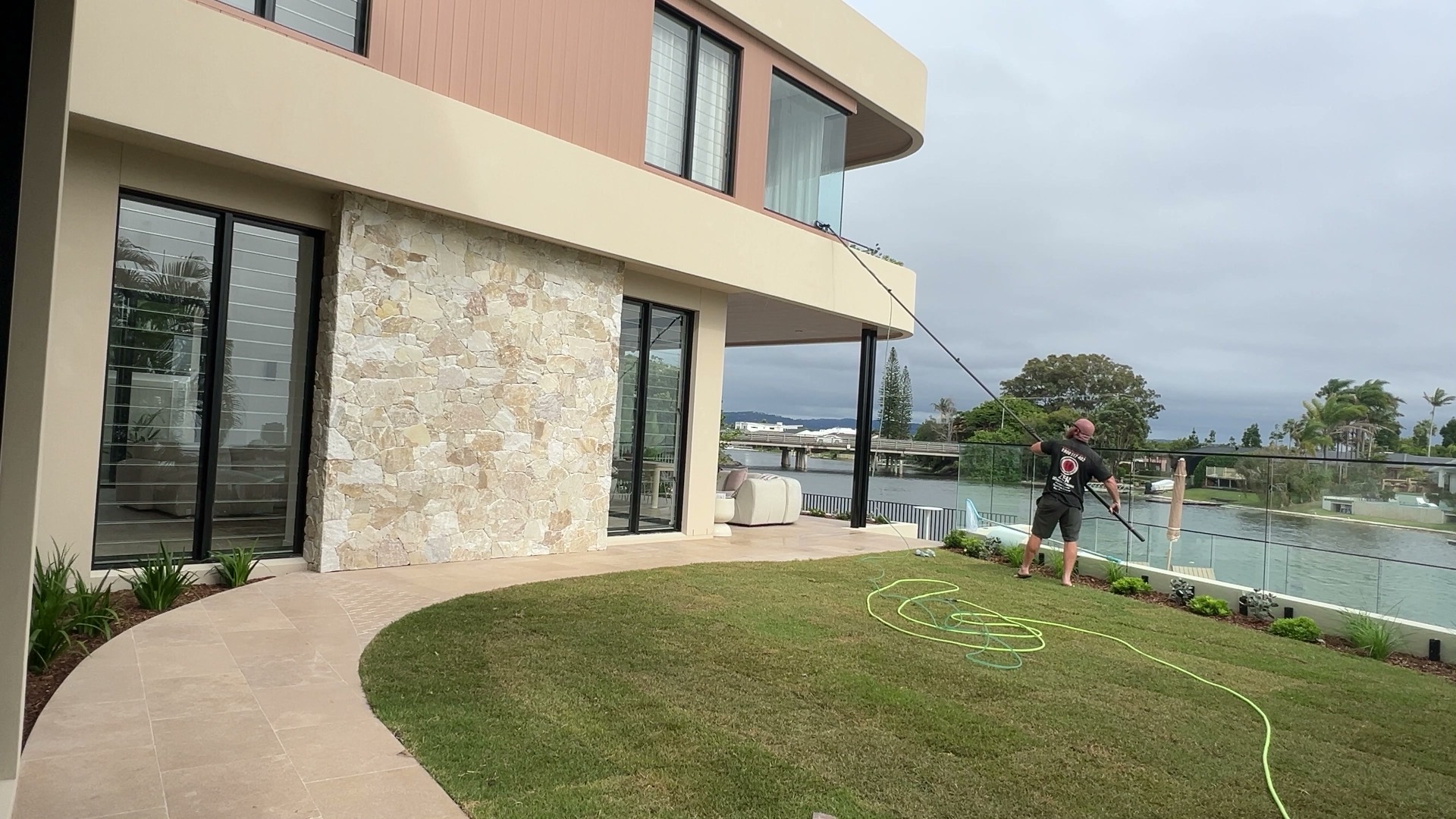 Water-fed pole window cleaning on a multi-storey Gold Coast property